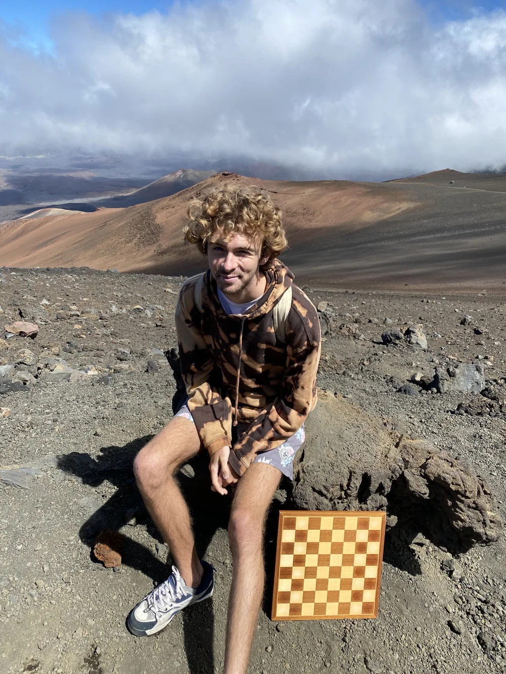 Coach Andre with a chessboard on Haleakalā