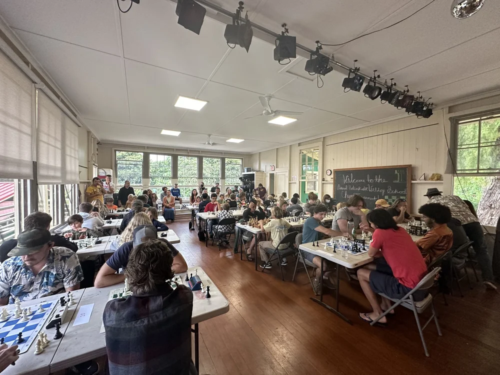 A full room of players at a chess tournament on Maui